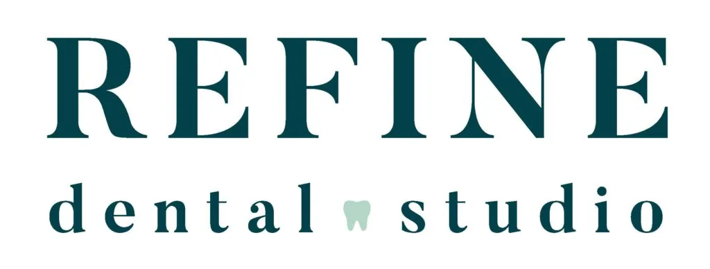 The image shows the logo of "REFINE dental studio." The word "REFINE" is written in large, bold, uppercase letters, and the words "dental studio" are written in smaller, lowercase letters below it. The letter "a" in "dental" is replaced with a tooth icon.